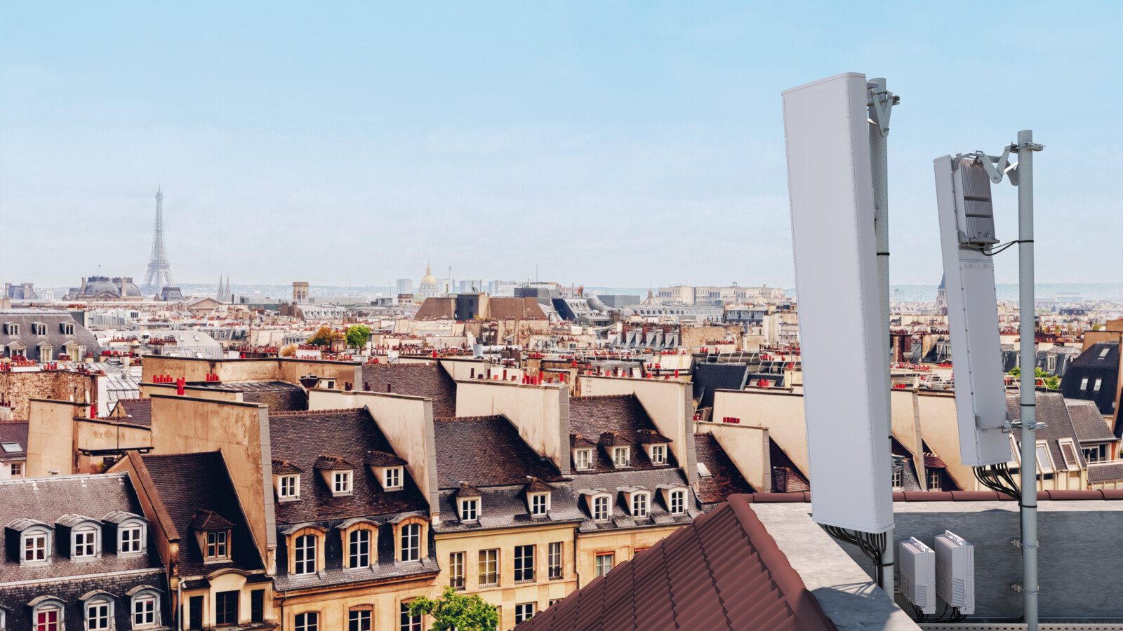 An antenna on a rooftop in dense urban area.