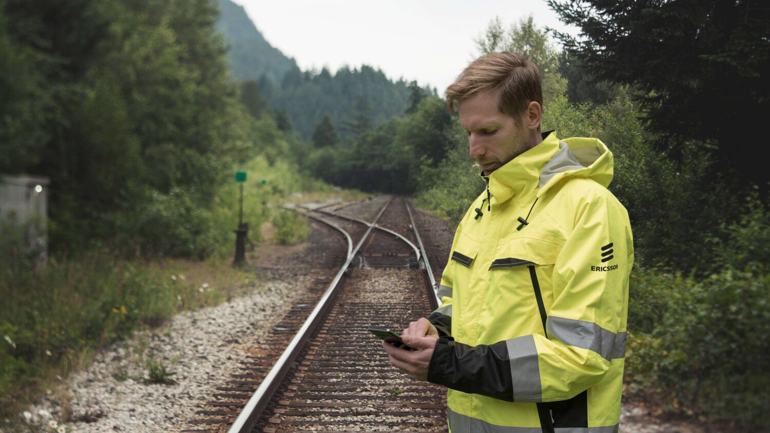 Engineer worker in train track area.