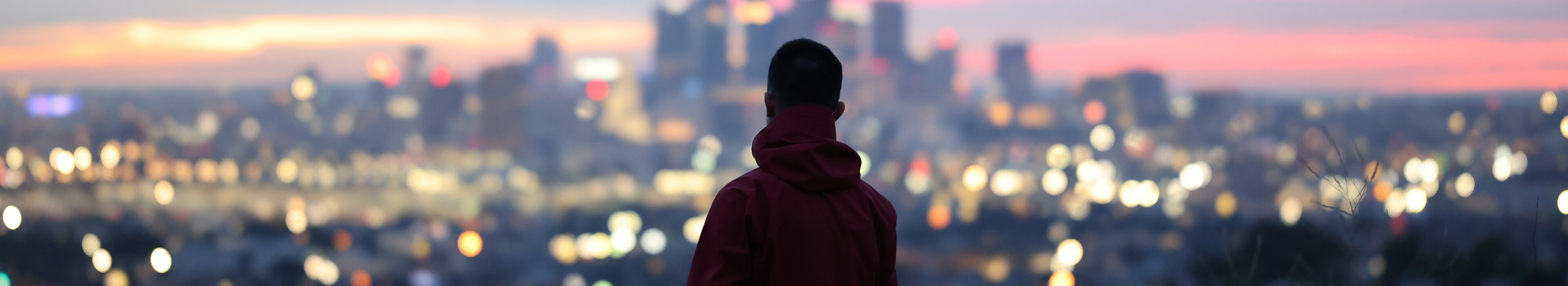 A man looking at the skyscrapers
