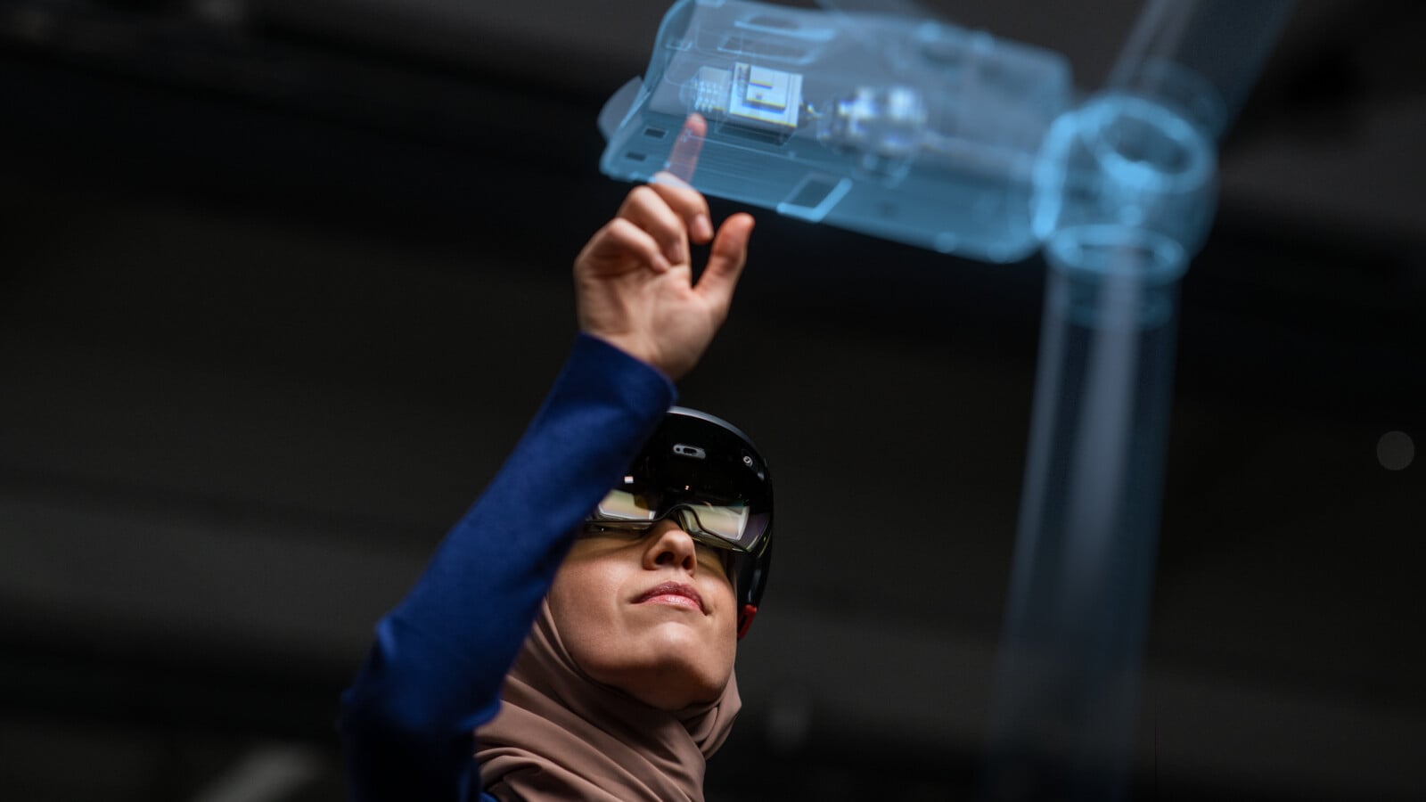 A female IT Professional working with AR glasses and holograms