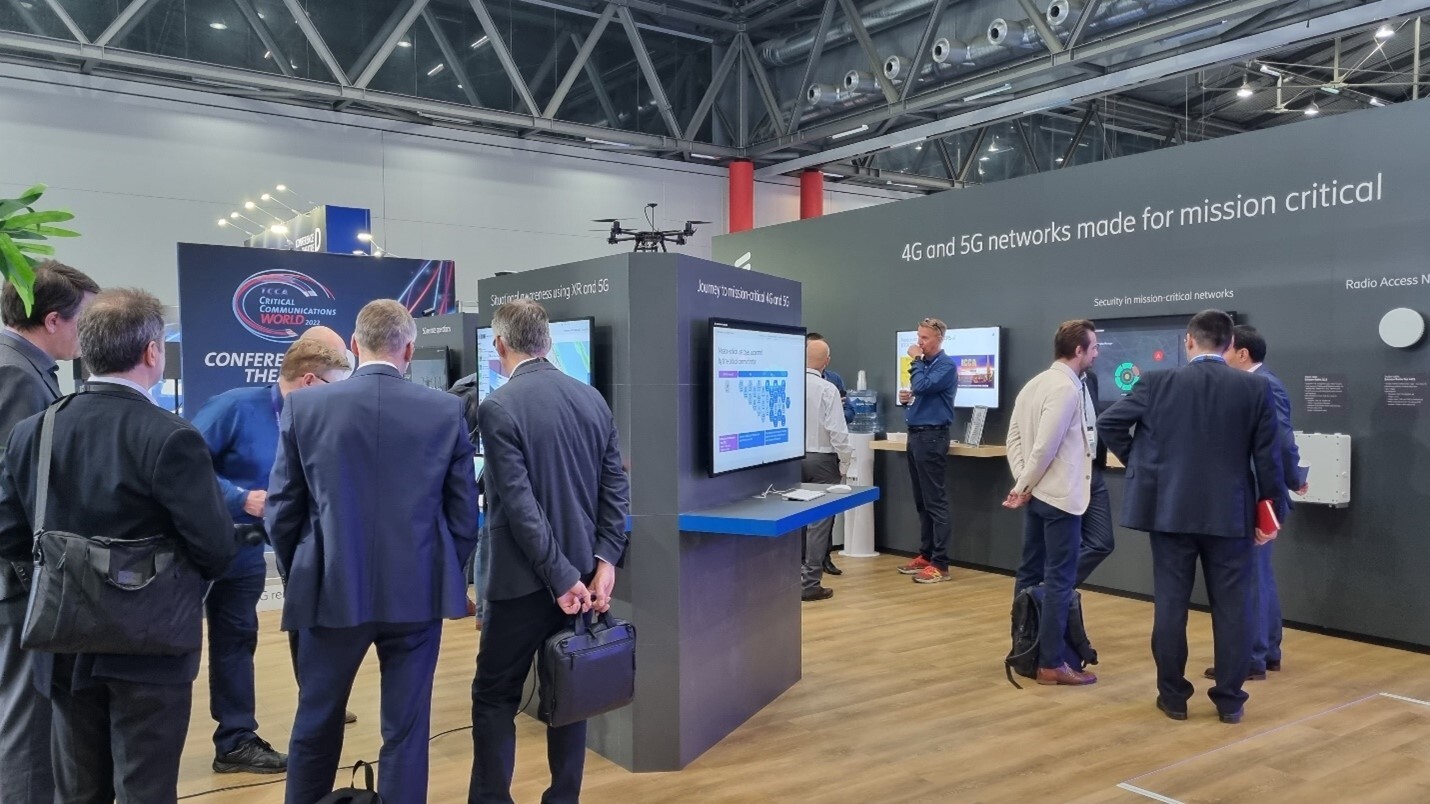 Ericsson booth with visitors exploring mission-critical network security and situational awareness using 5G and XR.