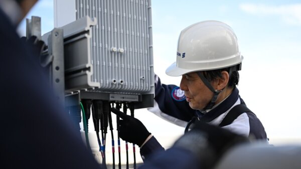 An Ericsson engineer in Japan works on network equipment