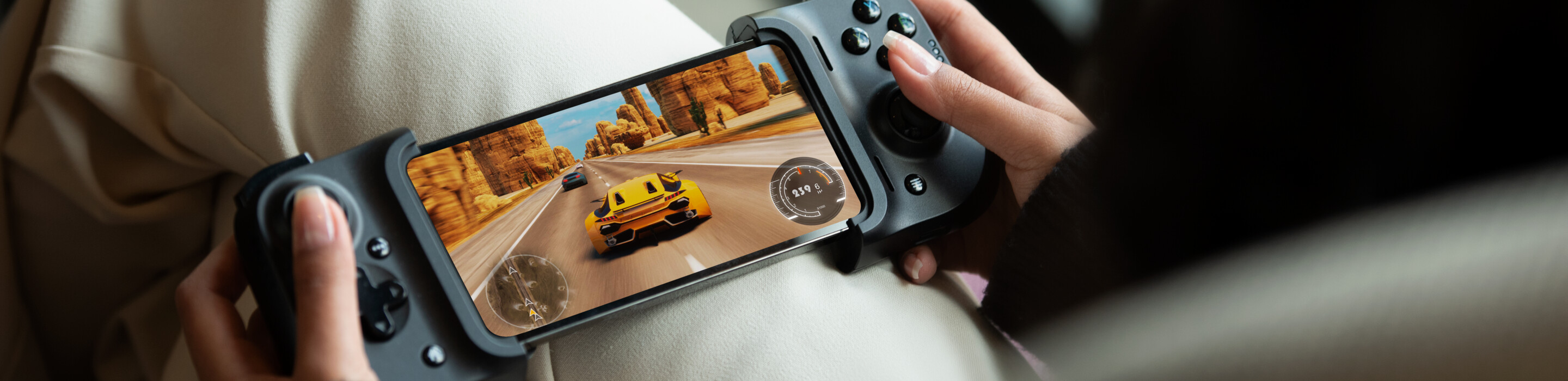 Hands holding a gaming device.