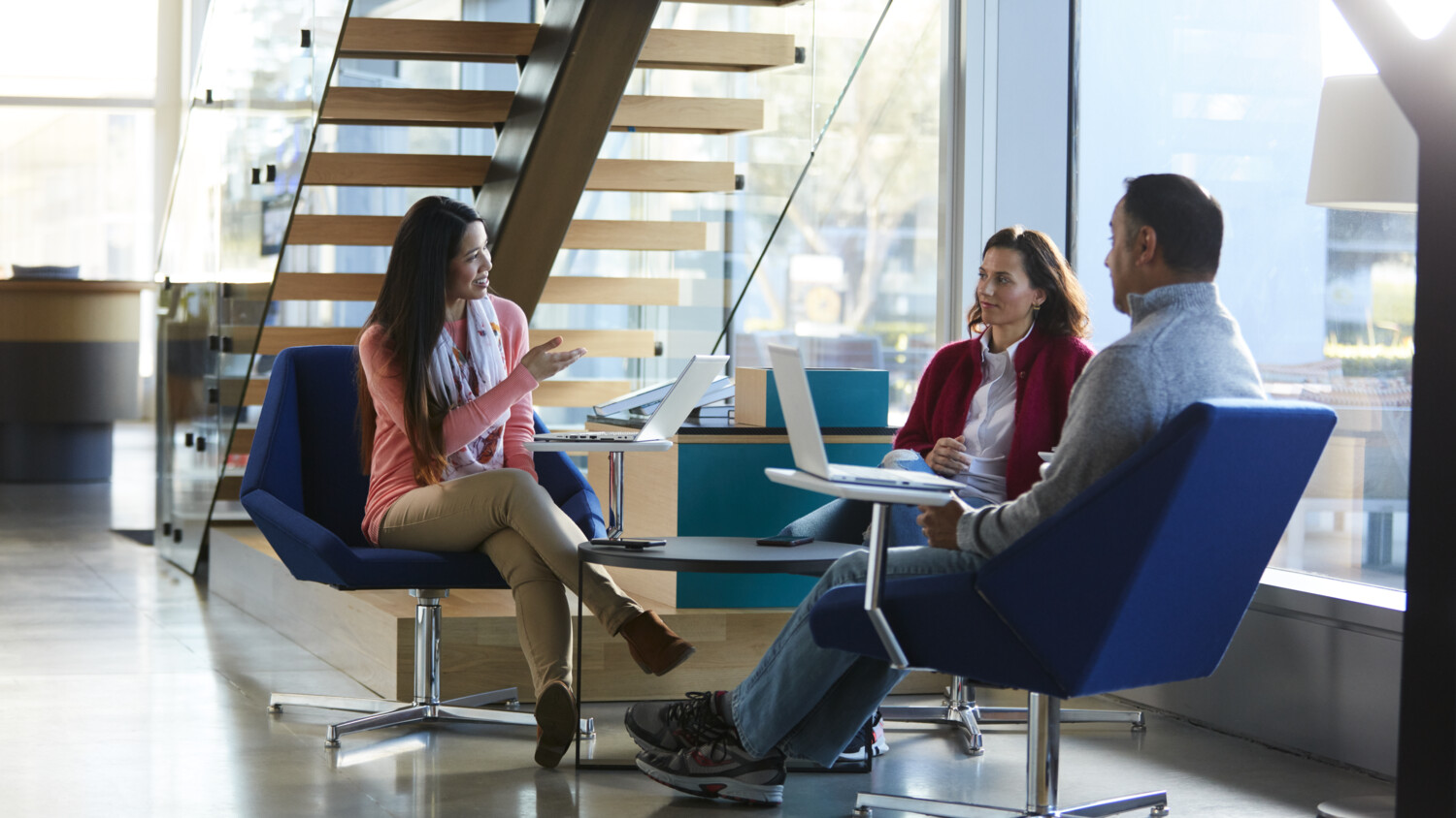 Employees sitting in the open space.