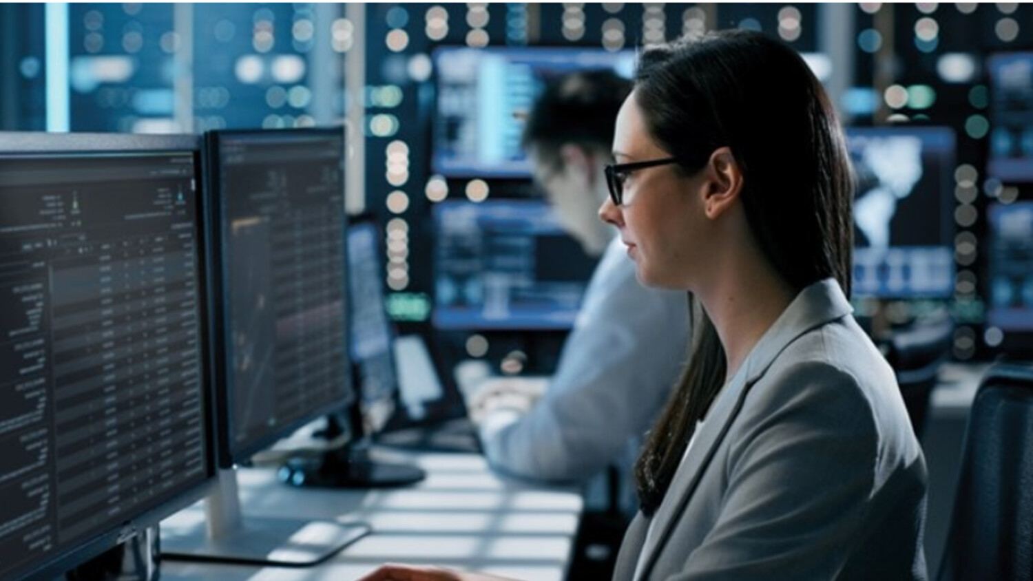 Woman looking at screens.