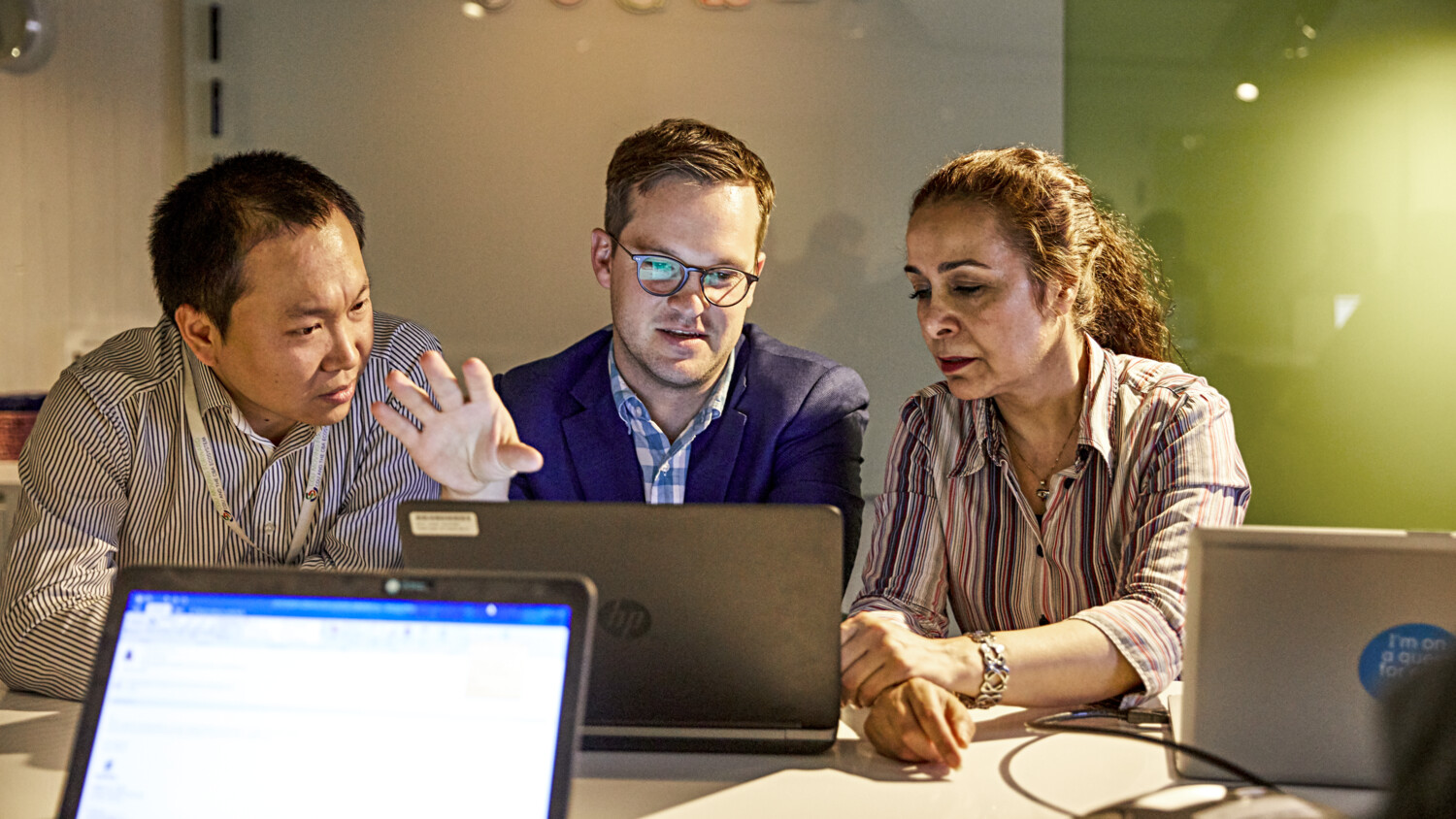 Colleagues in meeting room.