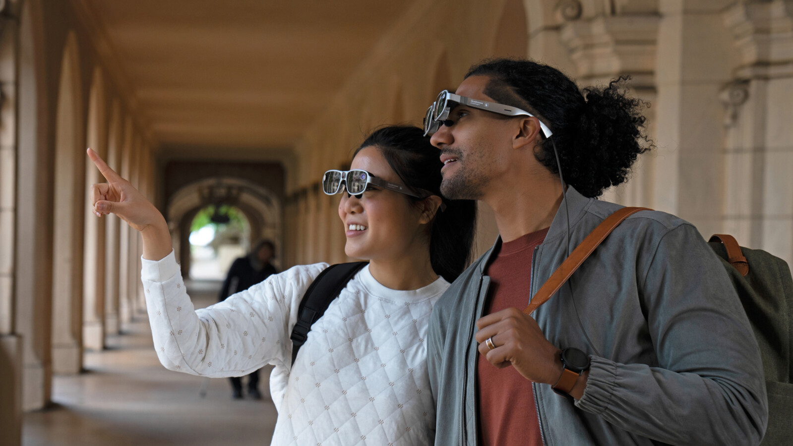 Two people wearing smartglasses.