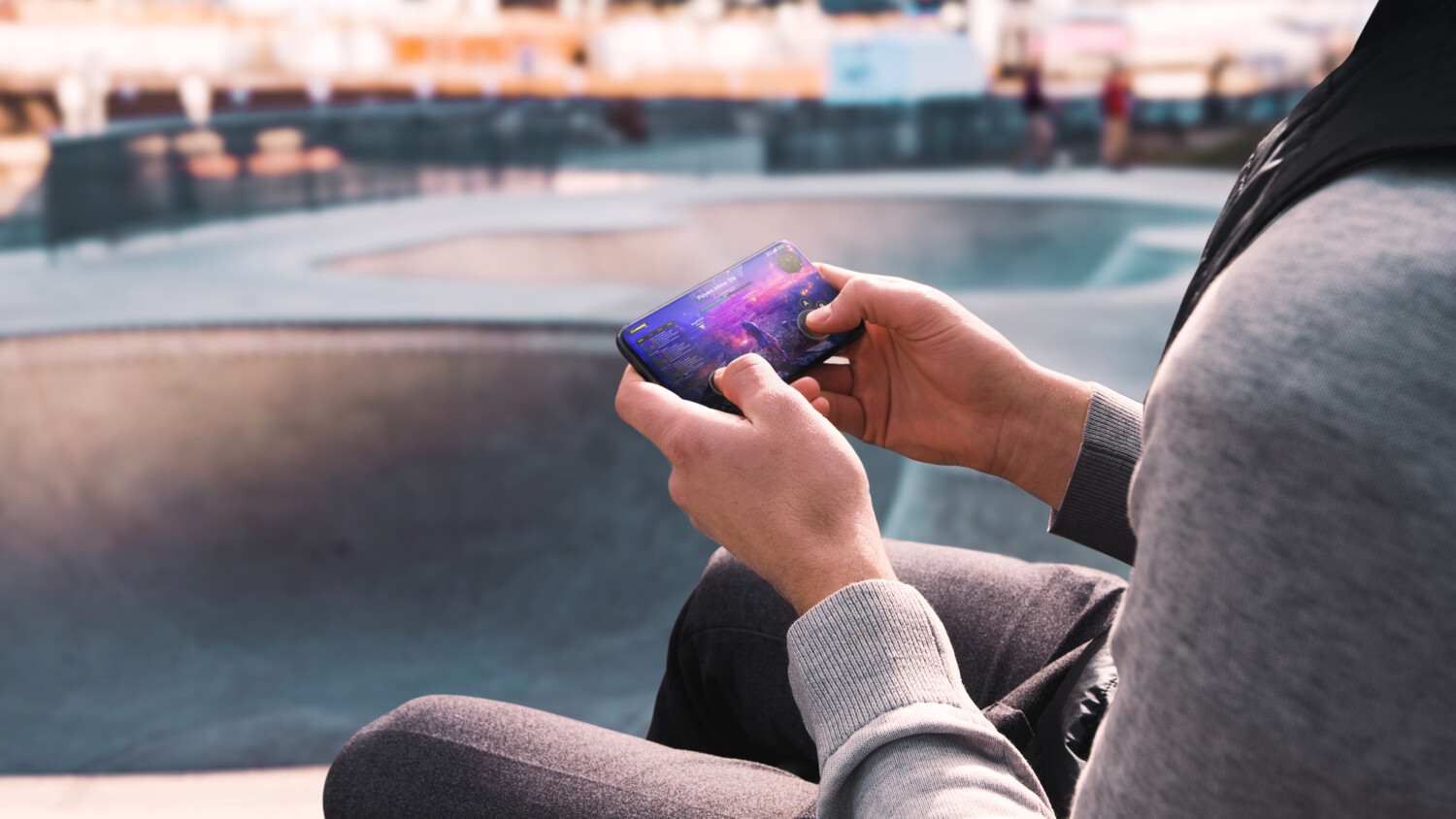 Hands holding a gaming device.