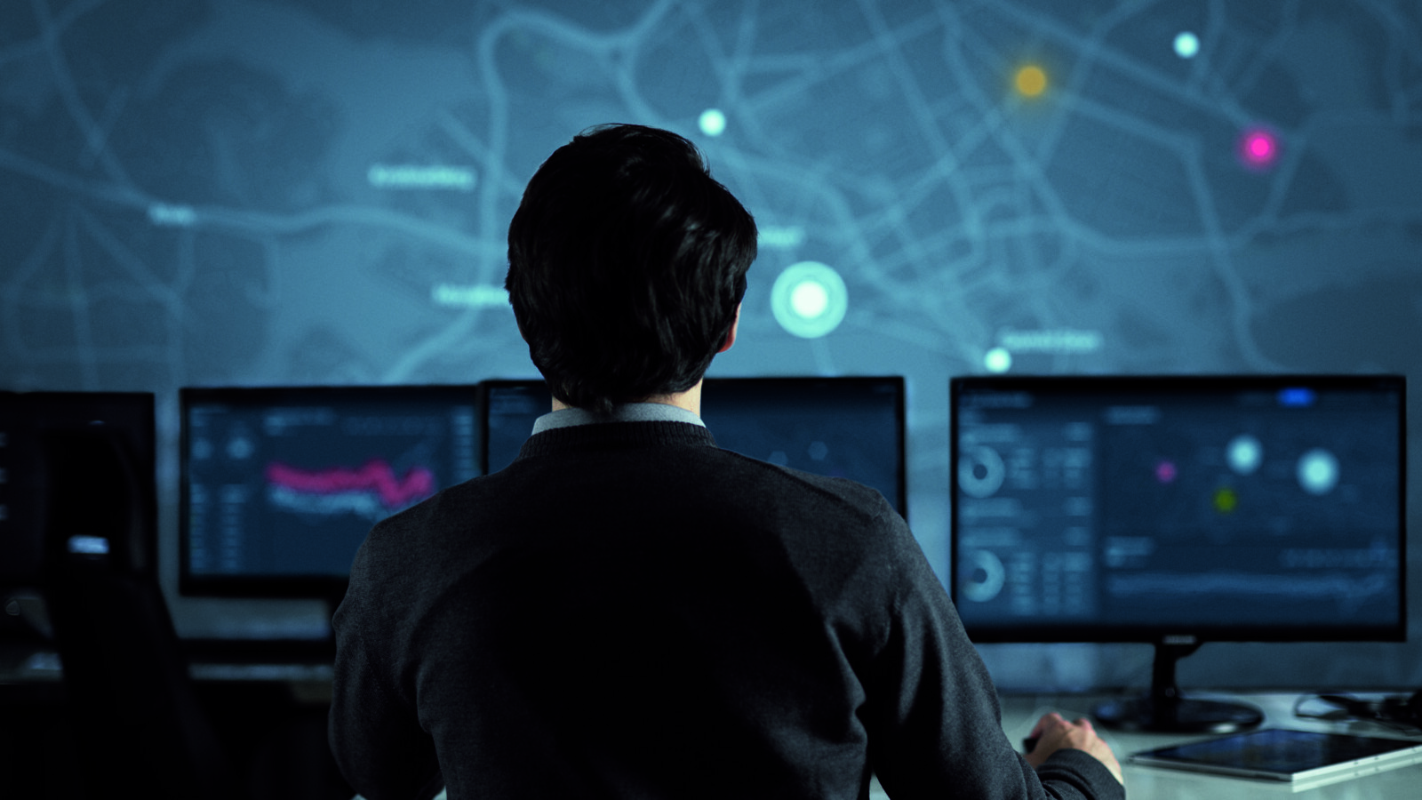 A man looking at the monitor