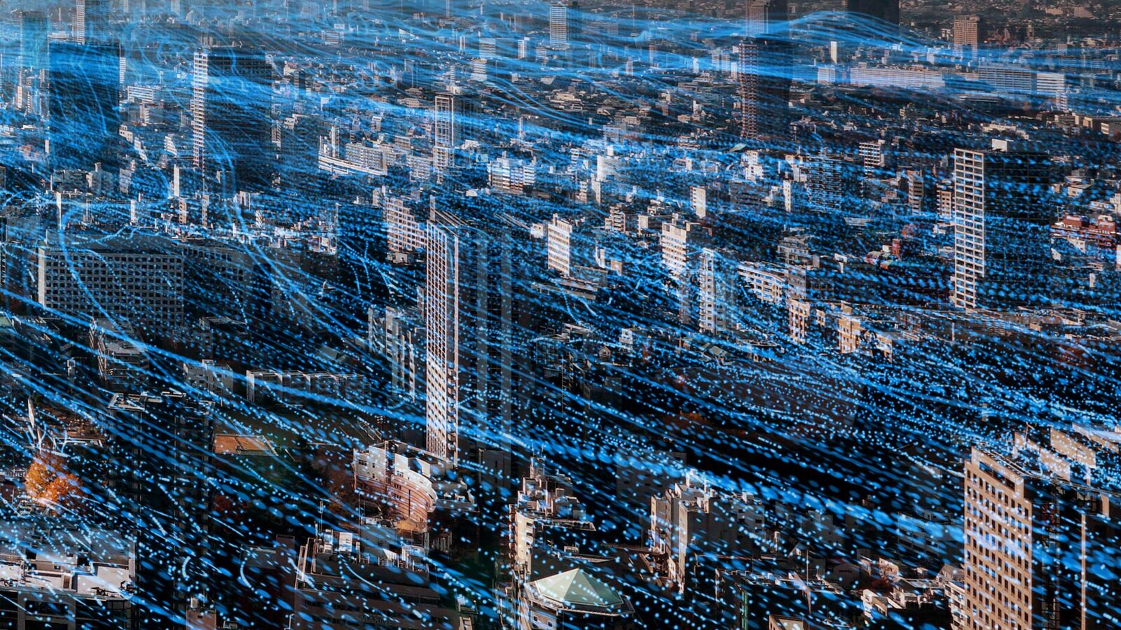 Cityscape with imagined 6G network traffic lines overlaid.