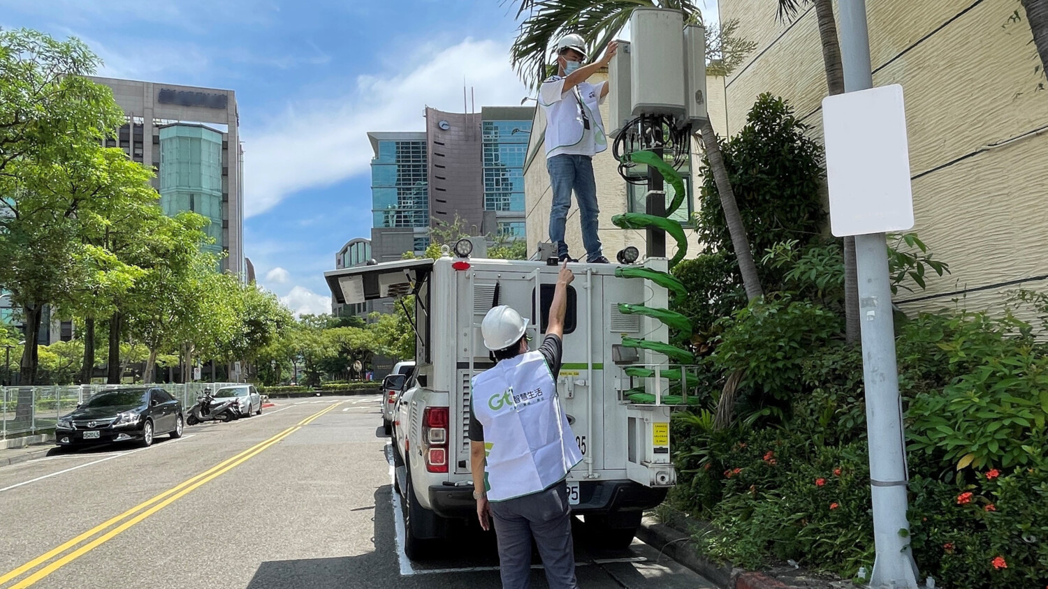Engineers testing  connectivity in a van with an attached base station
