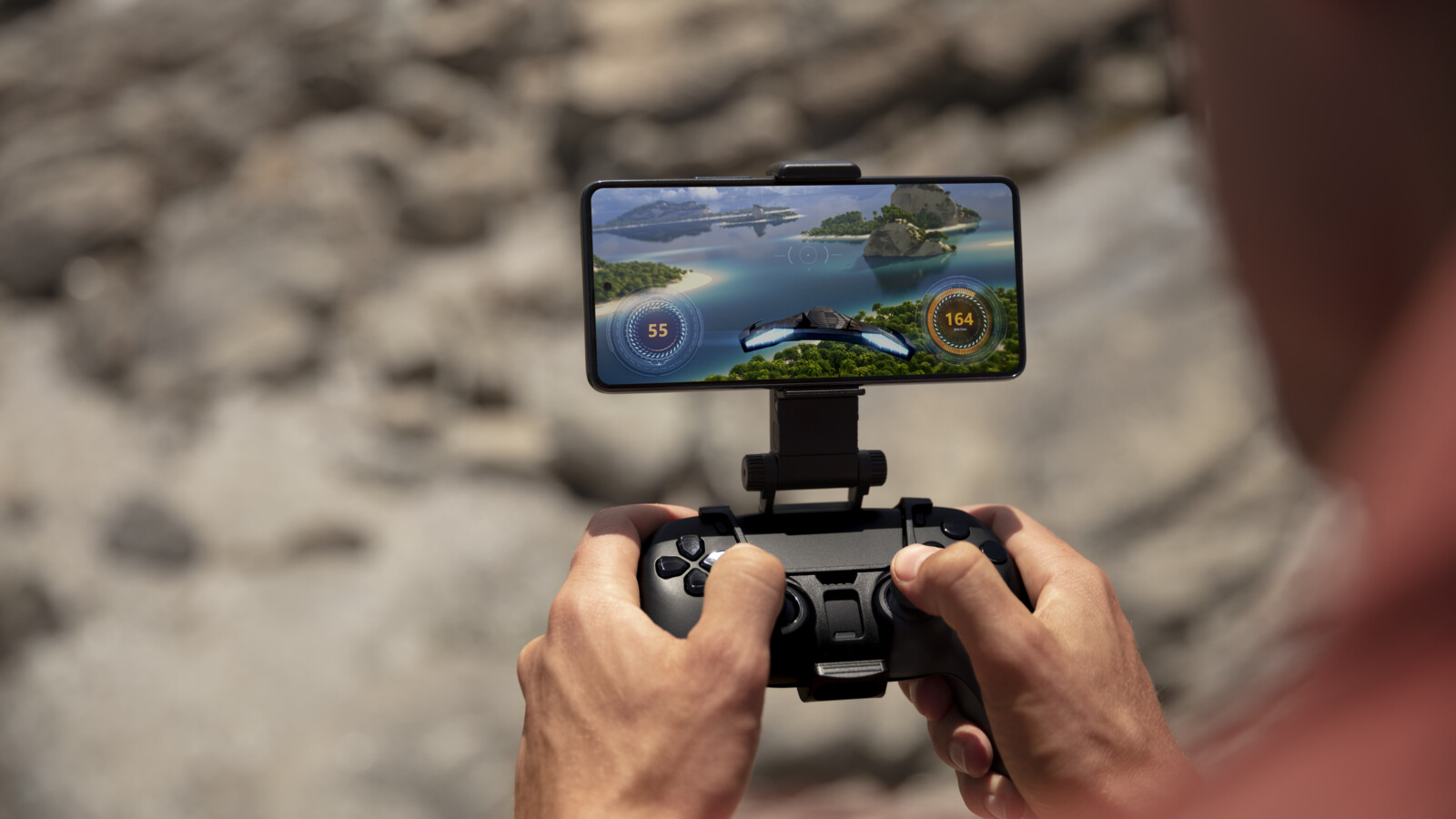 A man playing a game over 5G on his phone 4