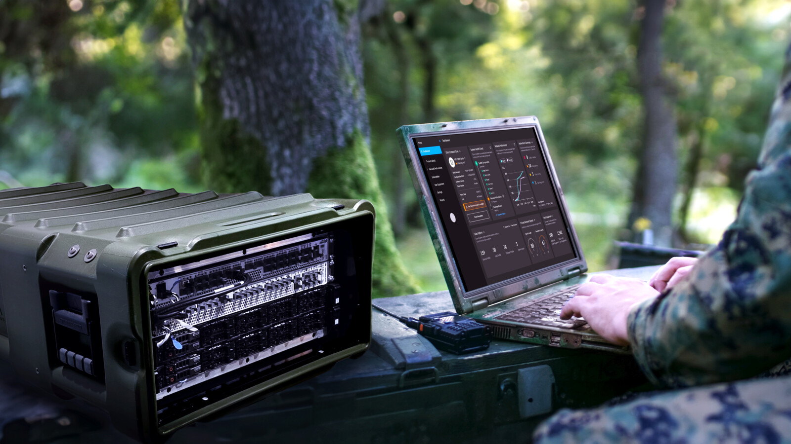 Person in military clothes using a laptop.