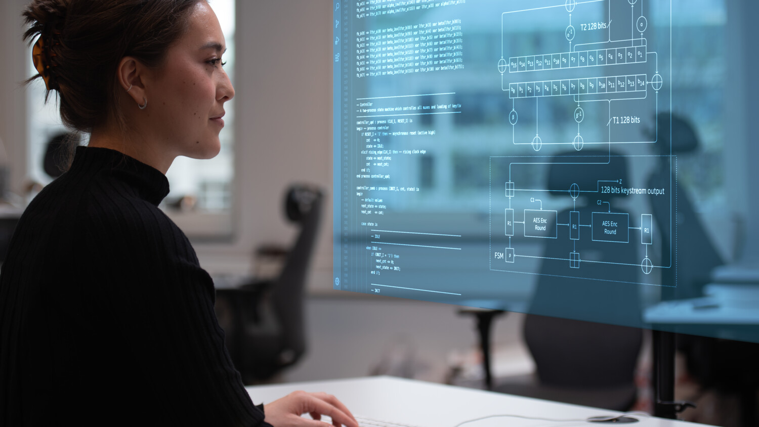 A woman in front of screen.