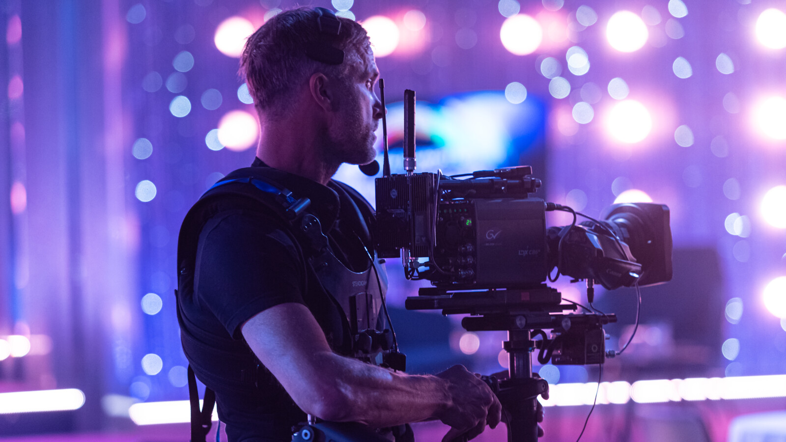 Man with camera in broadcast studio