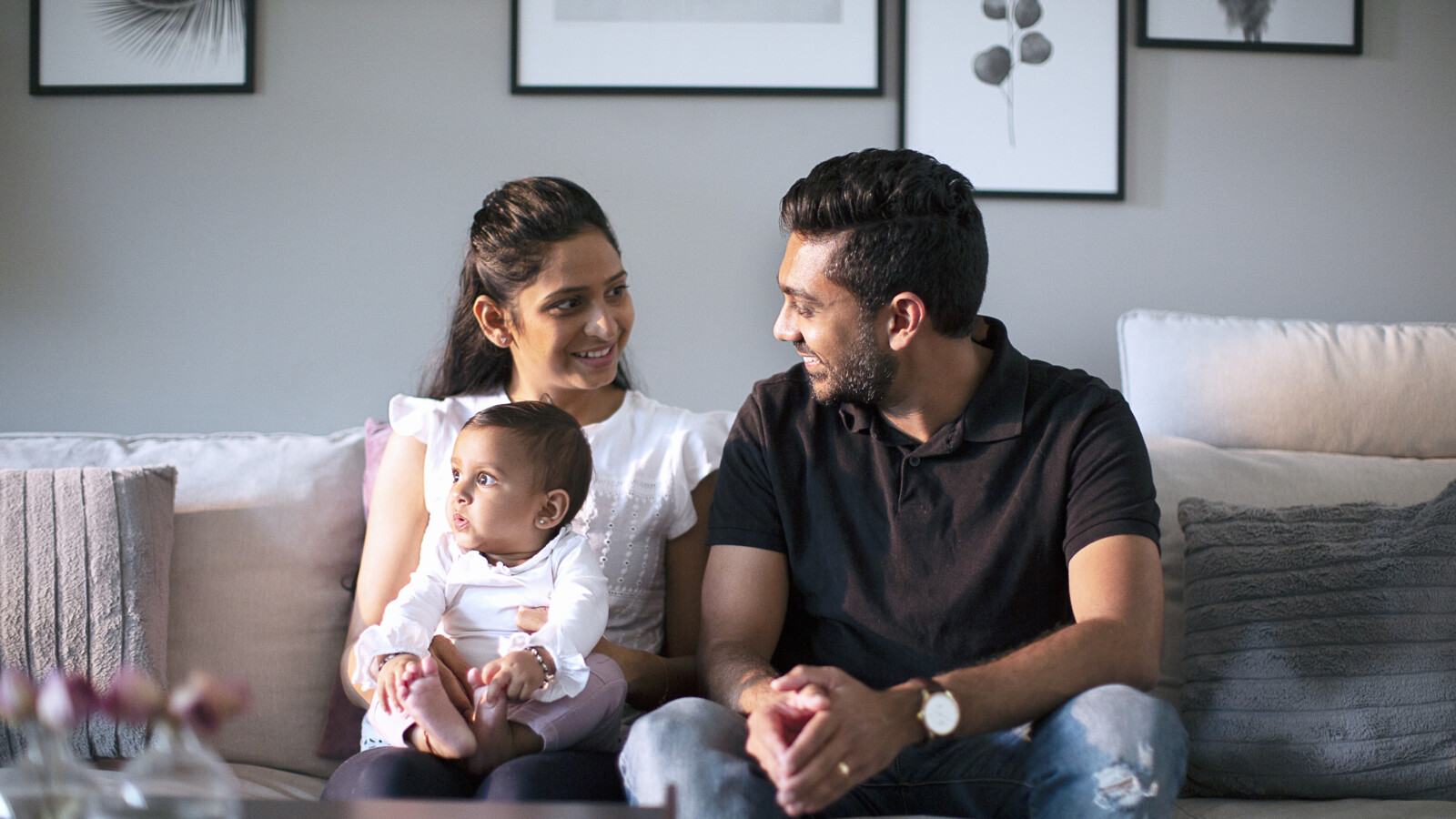Family sitting together with child.