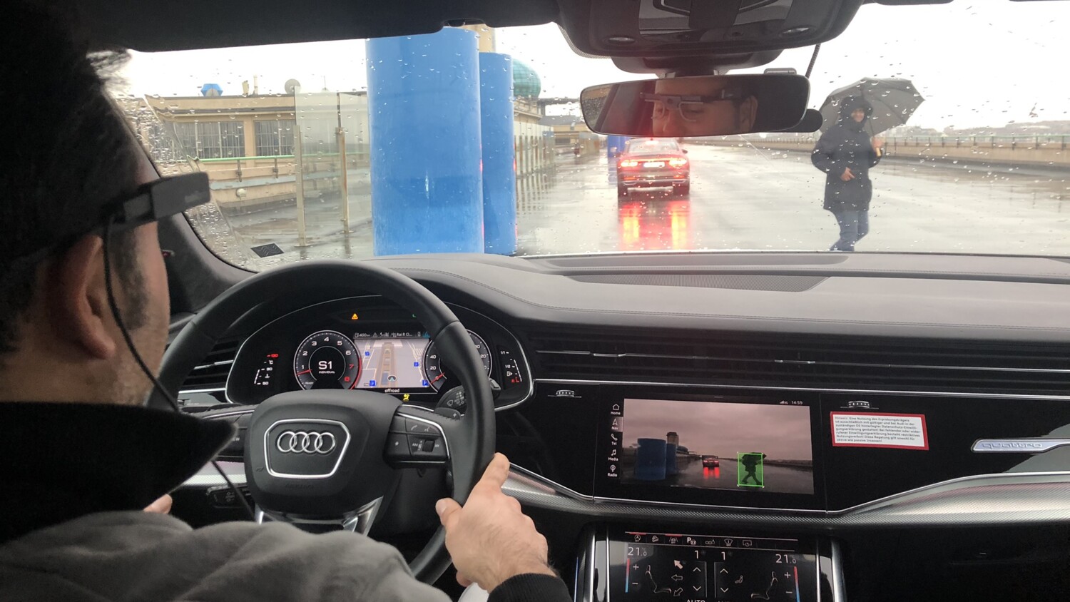 Person driving a connected car.