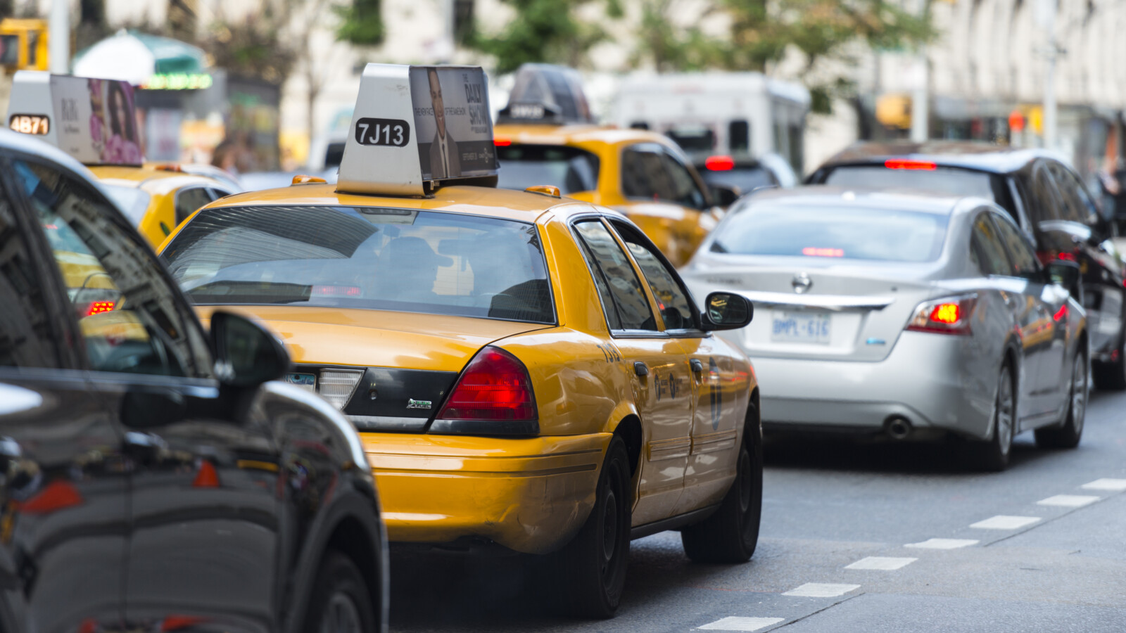 Yellow taxis on busy street in New York.