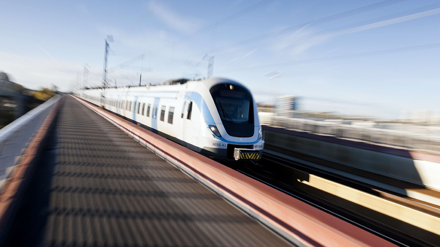 A modern railway train in motion.