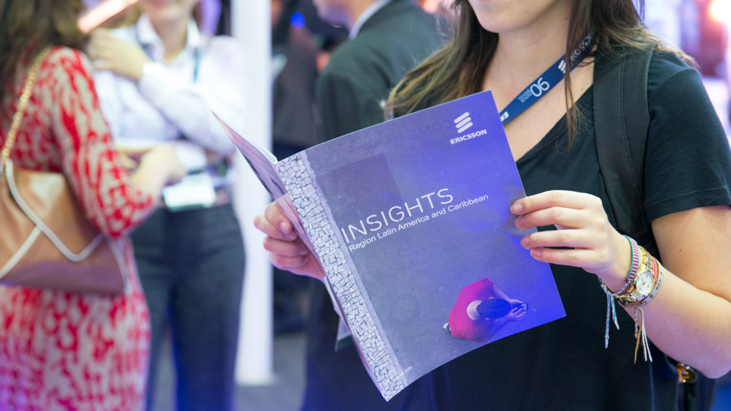 Woman reading a booklet at Futurecom.