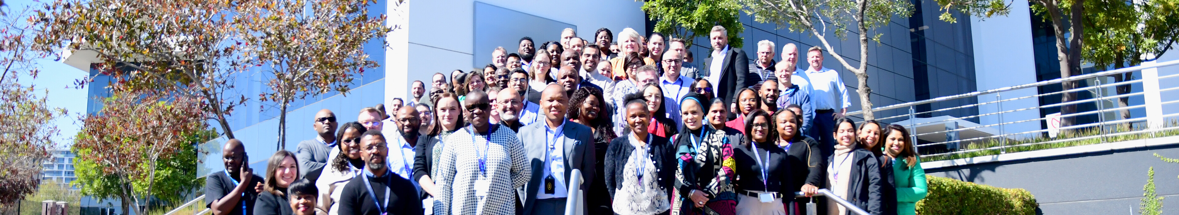 Employees standing outside the Ericsson South Africa office.