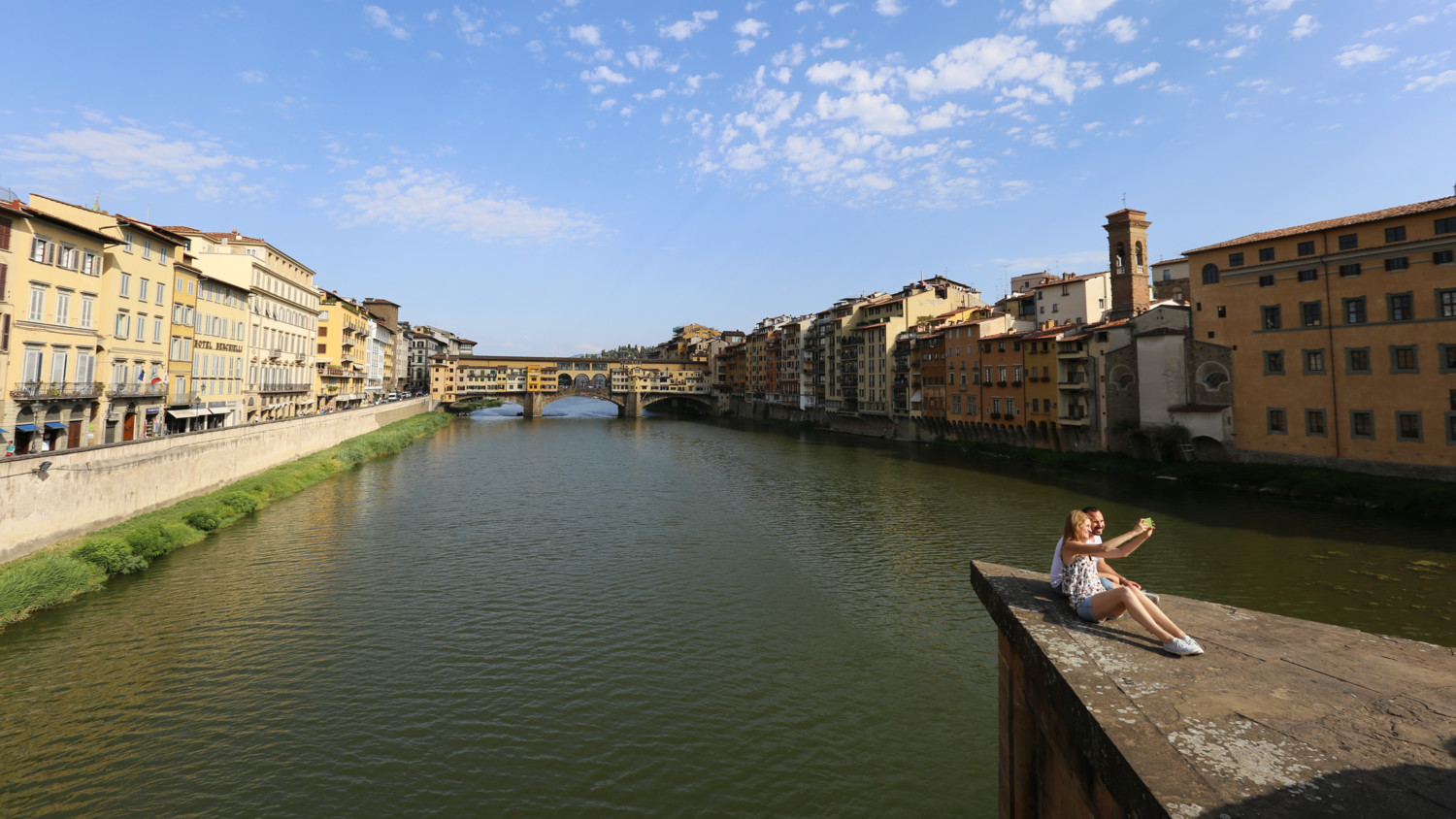 people taking photo on a bridge