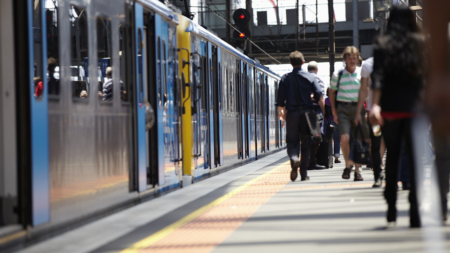People on a metro station platform.