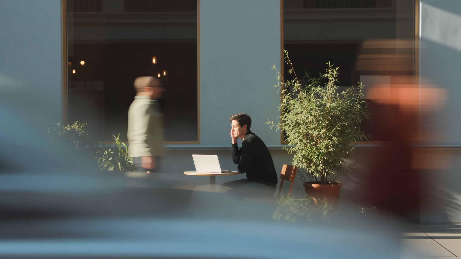 AI_generated Man working on laptop outside café