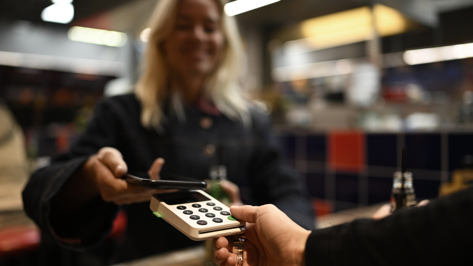 Customer making mobile payment at shopping mall