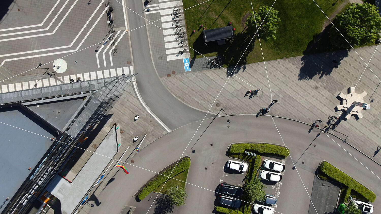 Aerial view of smart city streets, highlighting the wireless connections.