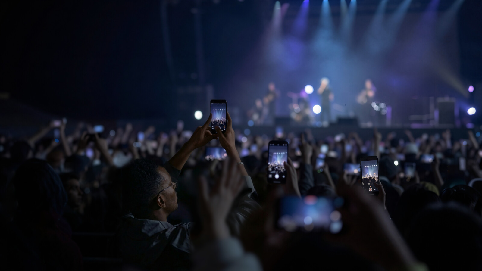 AI_generated Smartphones raised during live concert