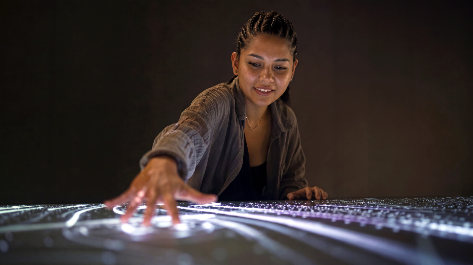AI generated woman interacting with immersive experience