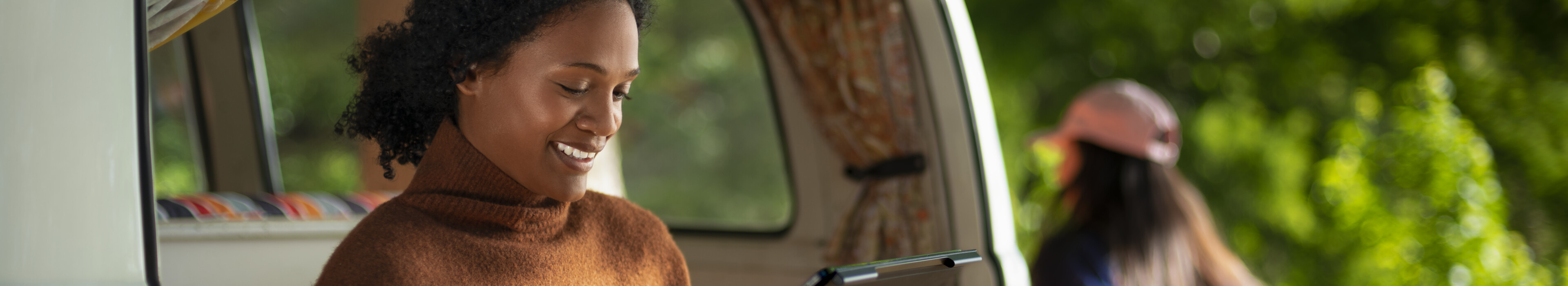 Woman using 5G tablet while travelling.