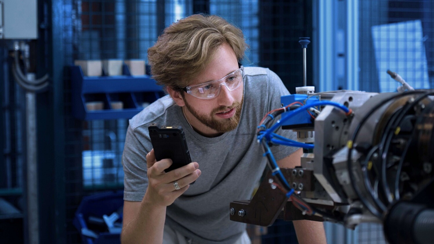 A man evaluating the robot part