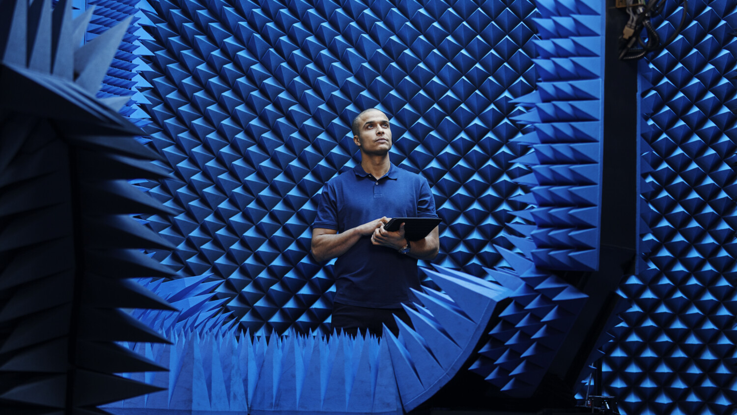 Man in testing room with iPad