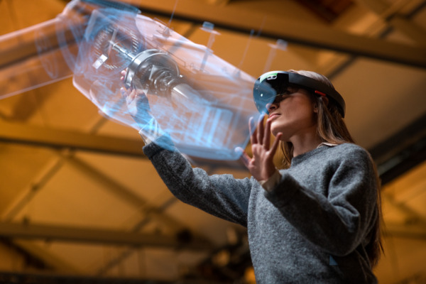 A Female professional working with 5G digital twin technology and industry 4.0