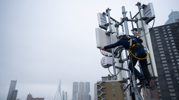 Engineer working on antenna at rooftop site