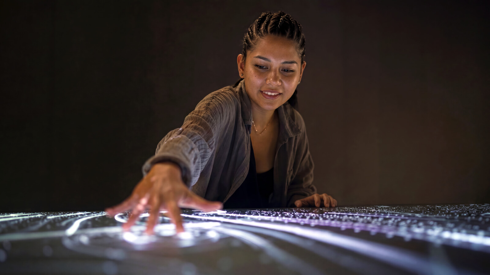 AI generated woman interacting with immersive experience