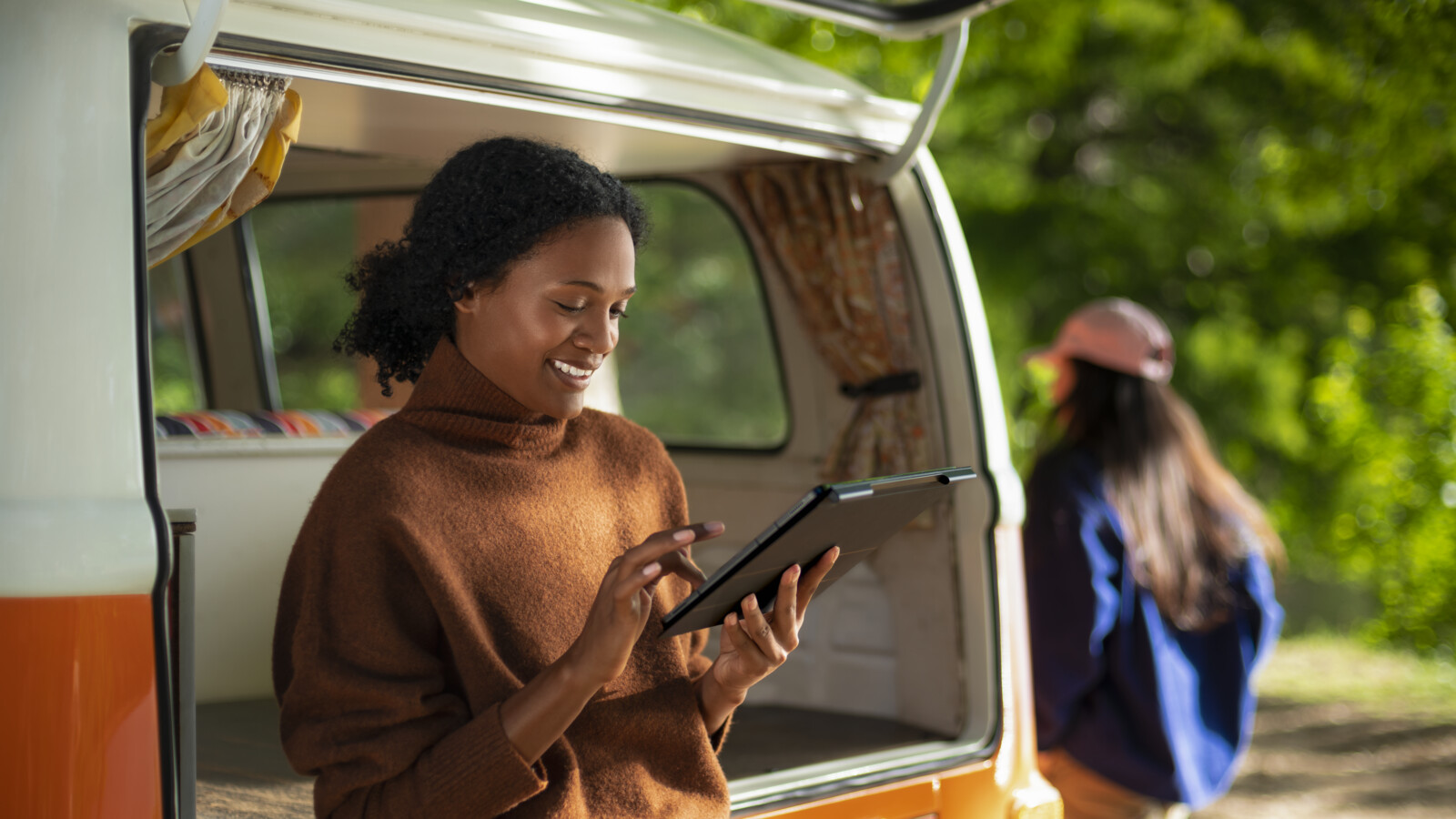 Woman using 5G tablet while travelling.