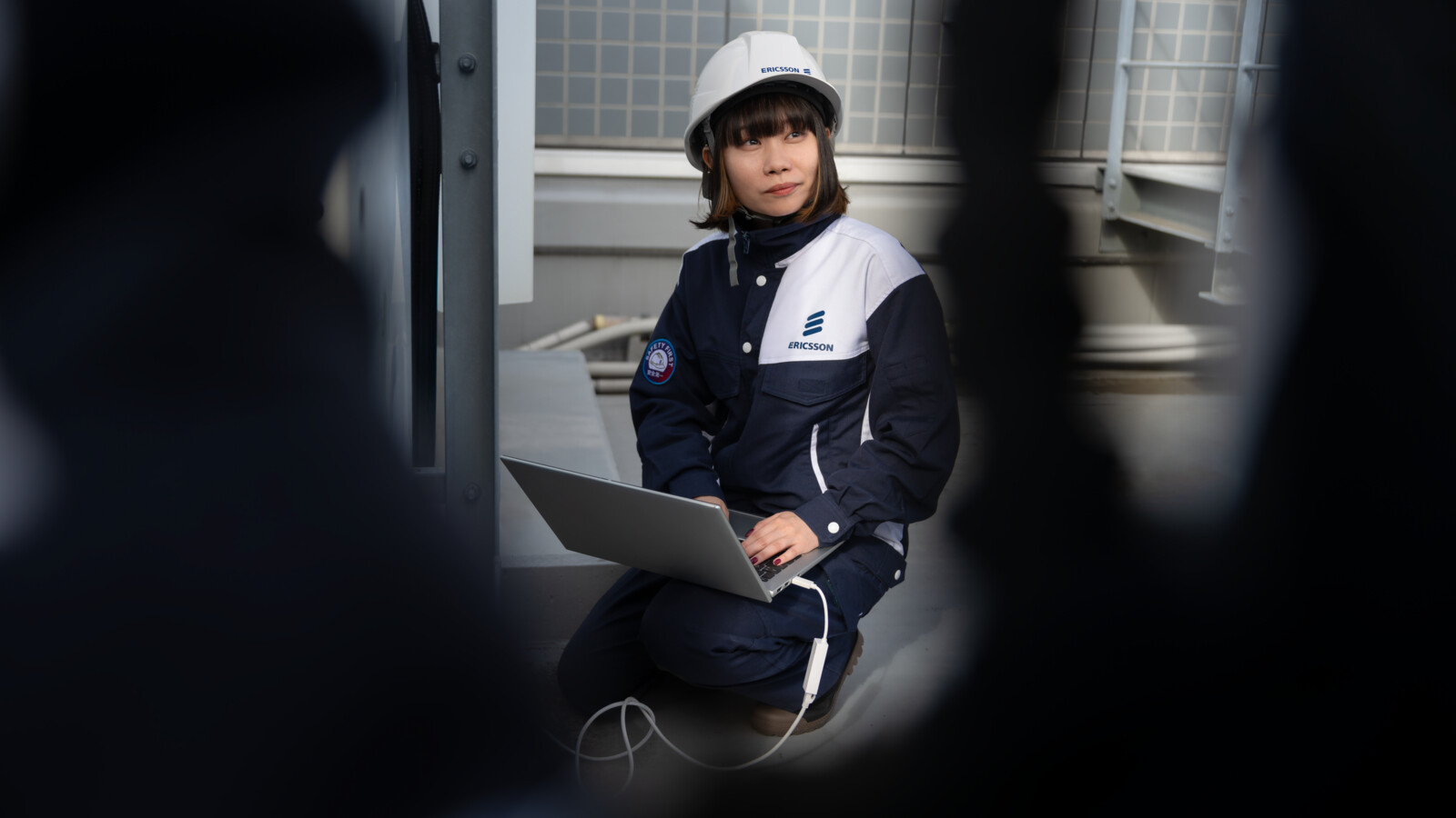 Female engineer working on rooftop site
