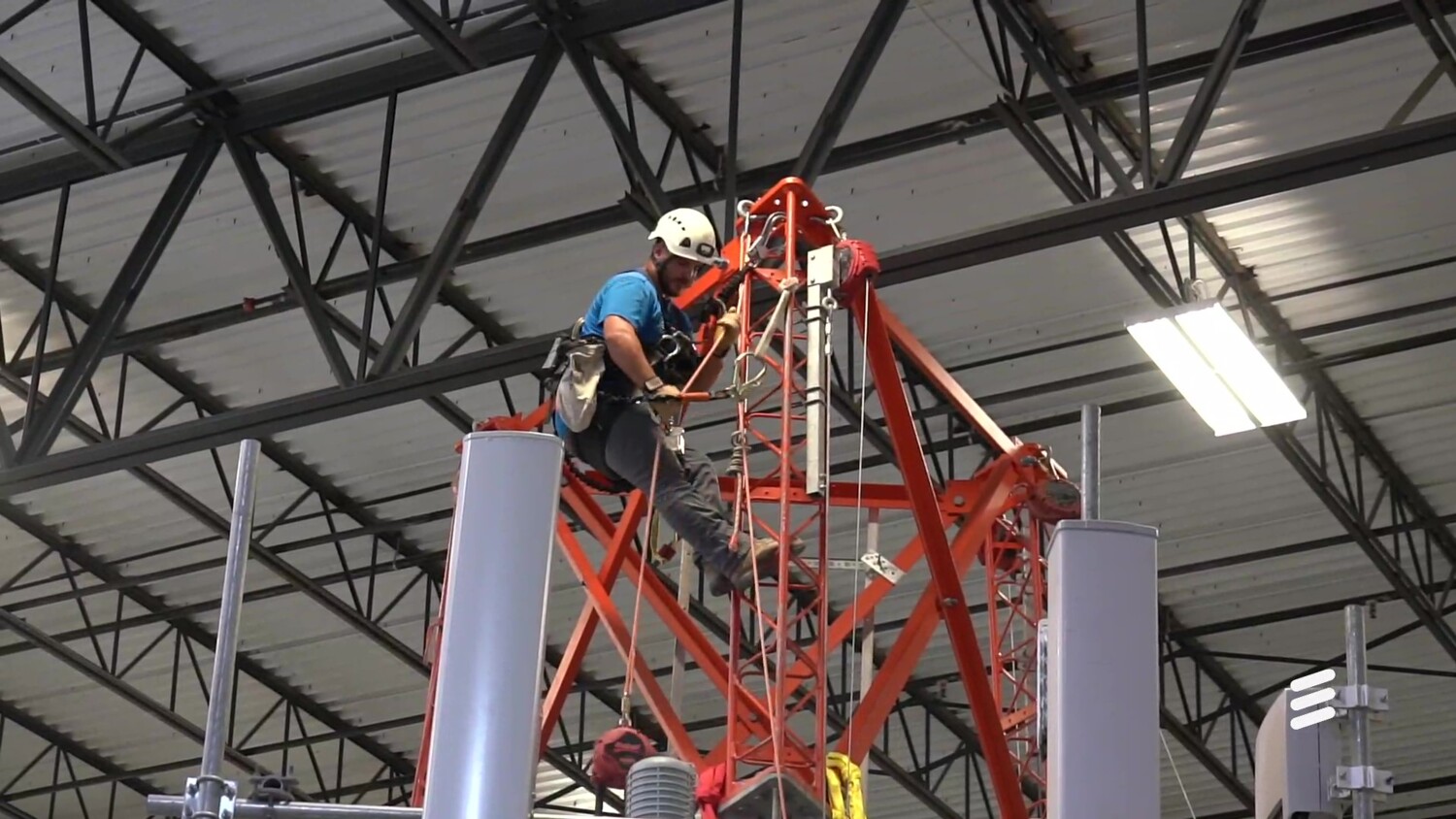 Engineer climbing on a tower
