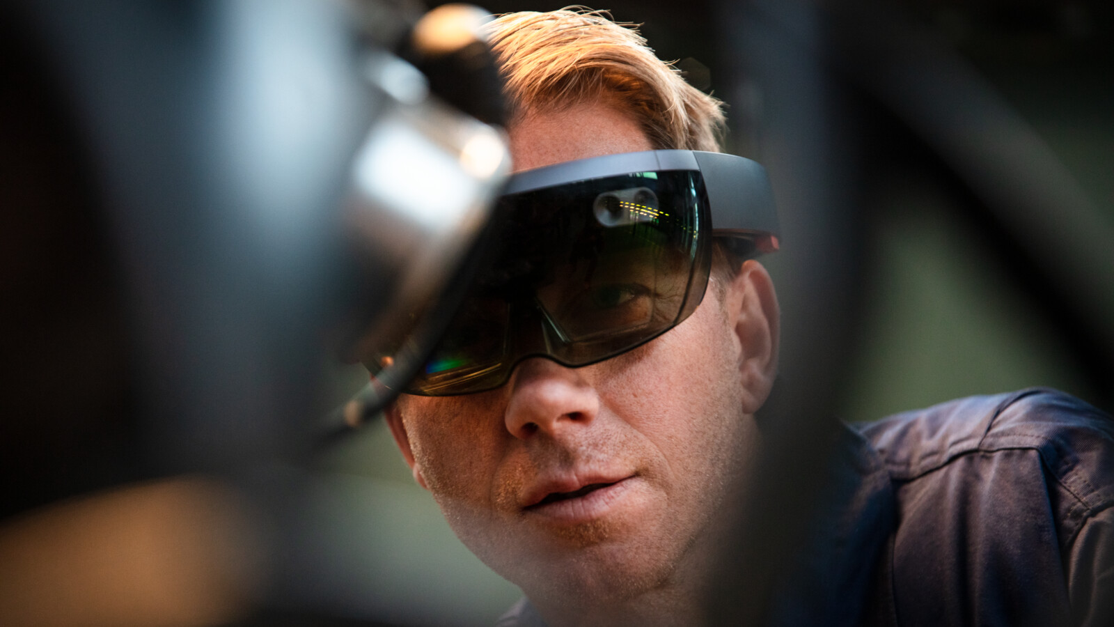 A man working in industry using augmented reality glasses