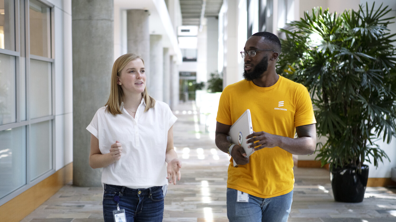 Daniel walking down the hallway with a colleague
