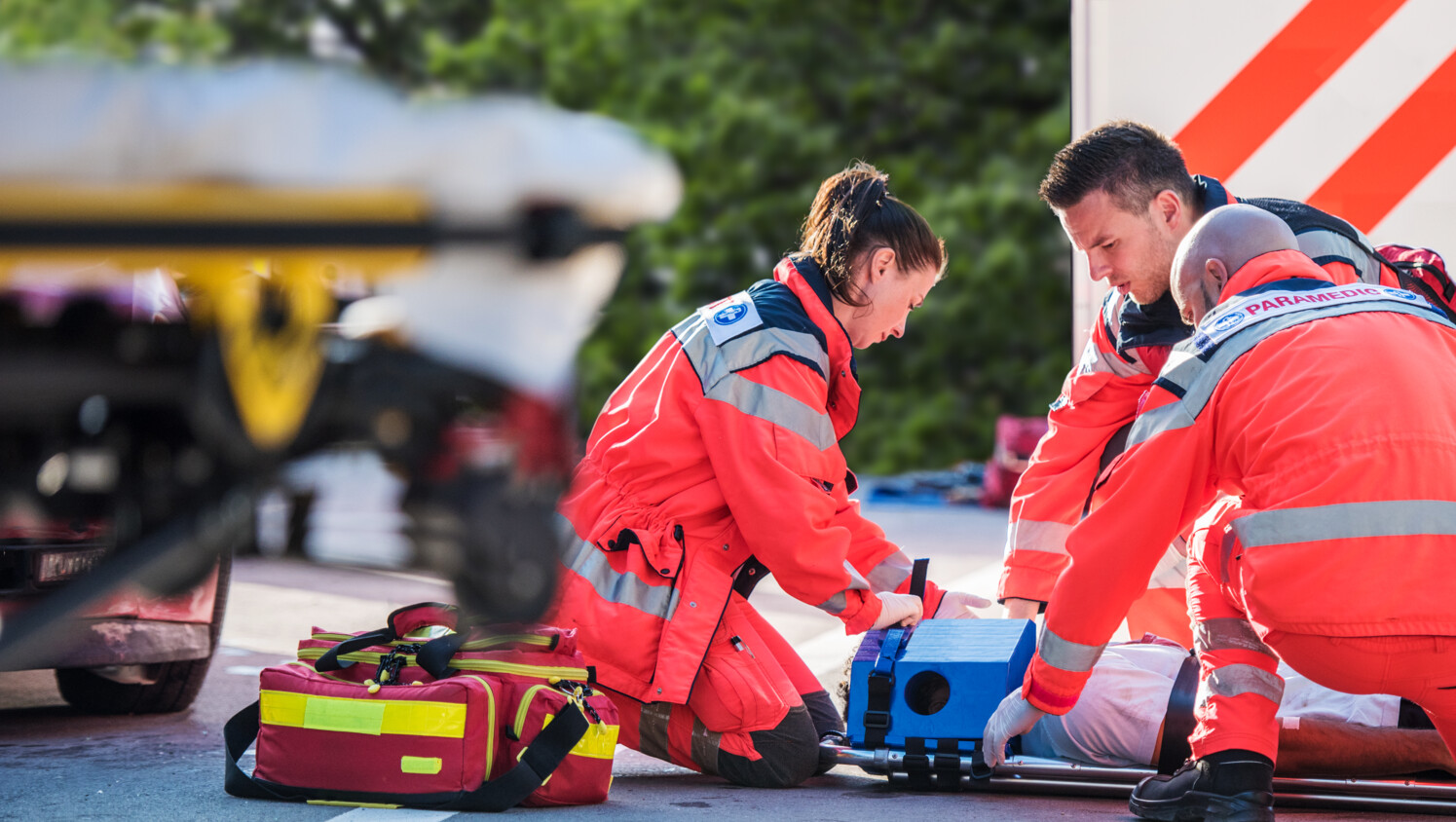 Paramedics with patient and equipment.