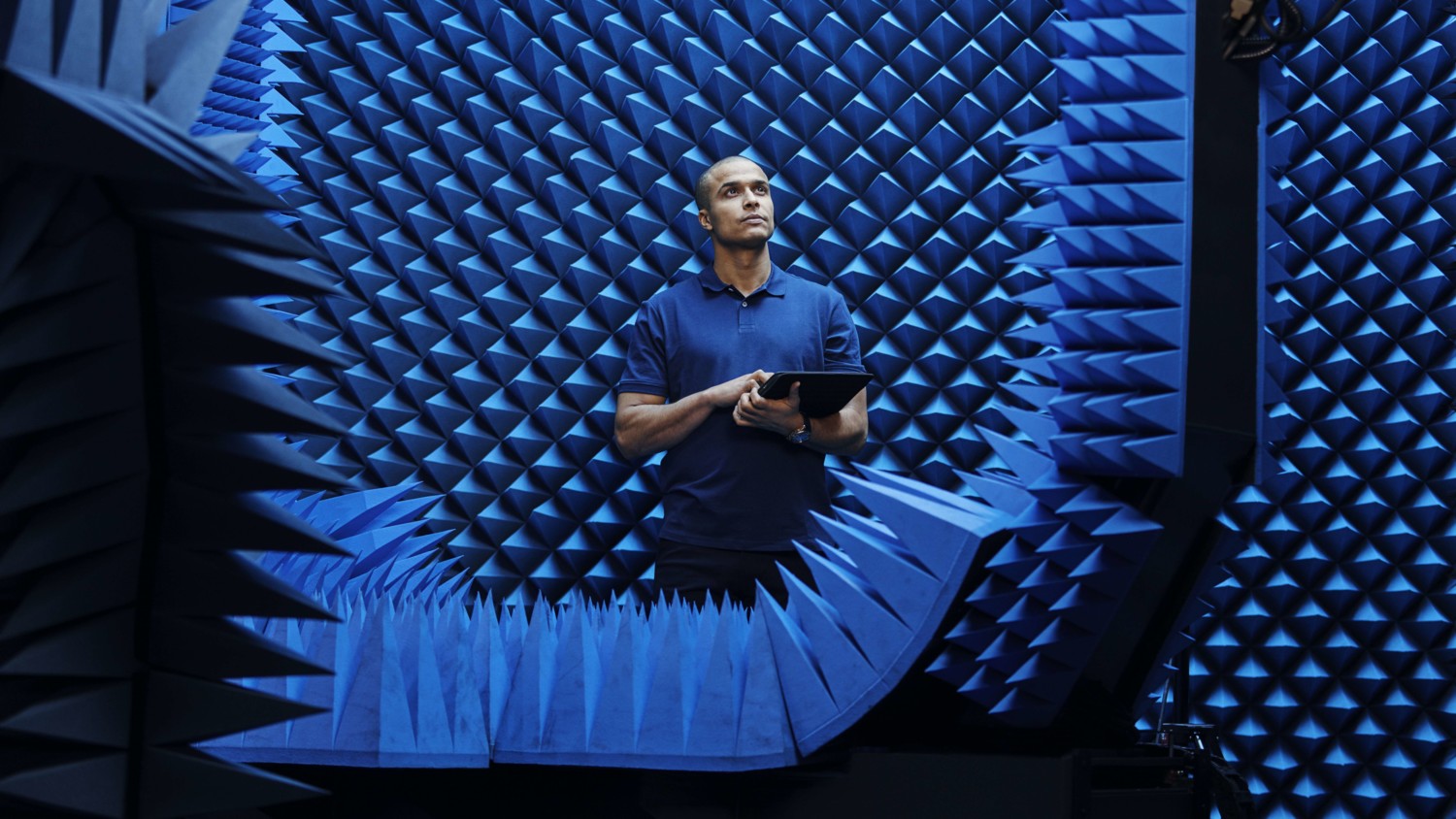 Man in testing room with tablet