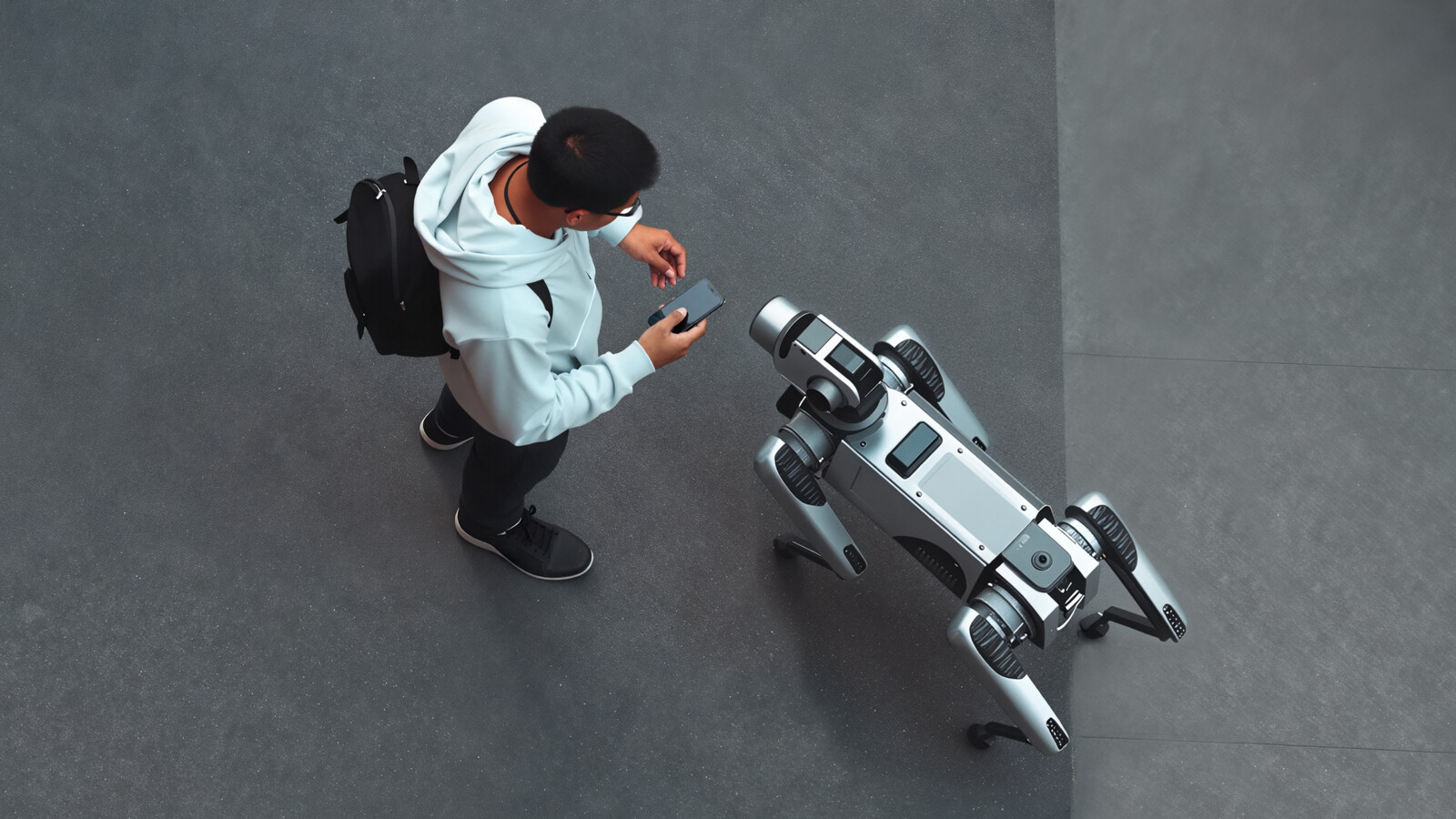 Robot dog walking on street among pedestrians