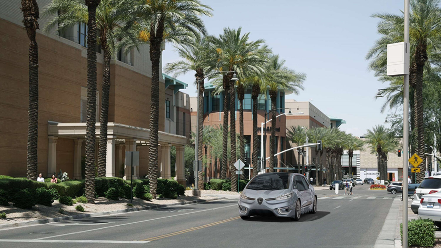 A car at a stoplight in the street. 
