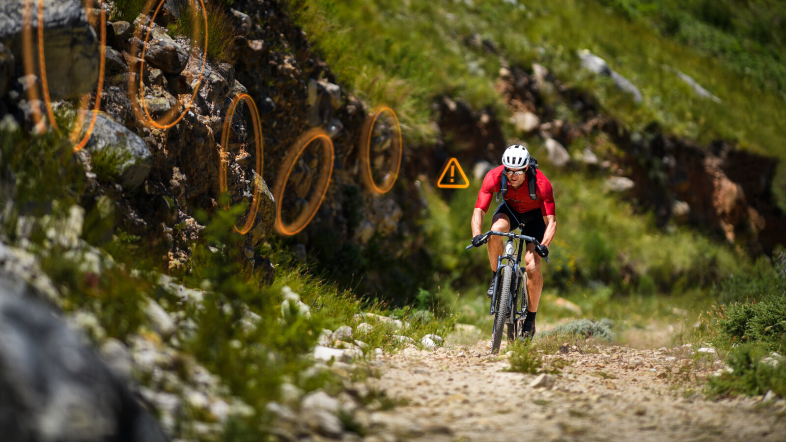 A mountain biker with support from an AI model running in real time to detect, recognize and alert the user in real time.