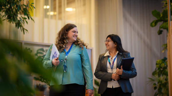 Employees having a walking meeting in our Kista office.