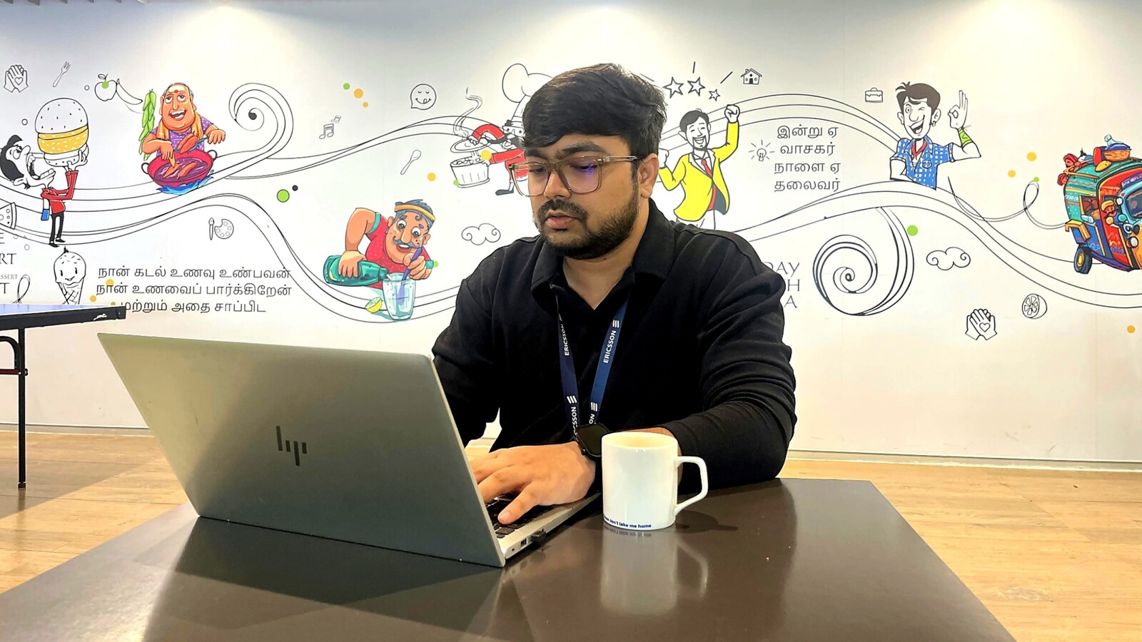 Paresh Gharat working at his desk.